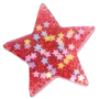 A glittery red star-shaped magnet with smaller, lighter-colored holographic stars embedded inside.